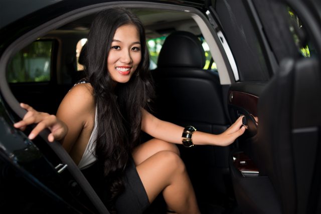 Glamorous beauty sitting in a lux car